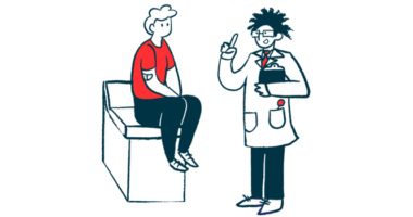 A doctor consults with a patient who's seated on an examining table.