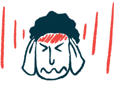 A person with a headache presses his hands against the sides of his head.
