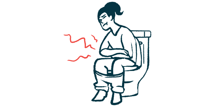 A woman has pain as she sits on a toilet.