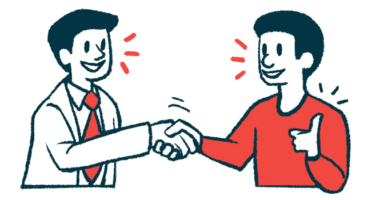 Two people shake hands to show collaboration.