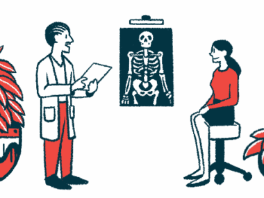 A doctor talks with a patient with an X-ray on display.