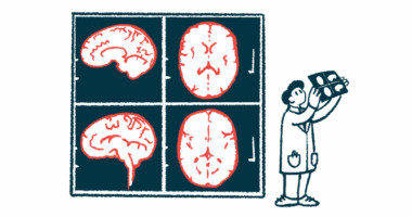 A clinician reviews the results of a brain scan, which is projected on the wall behind him.