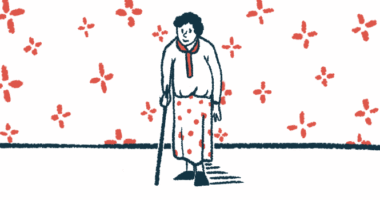 A woman uses a cane while walking.